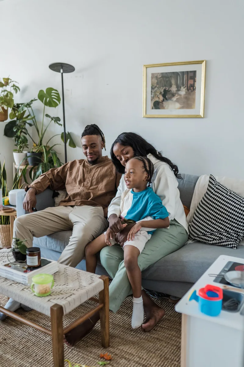 Family sitting together on a sofa.