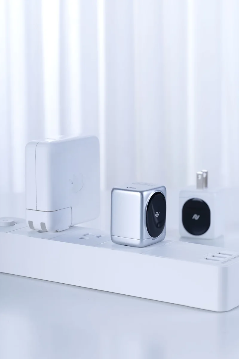 Chargers connected to a power strip on a table.