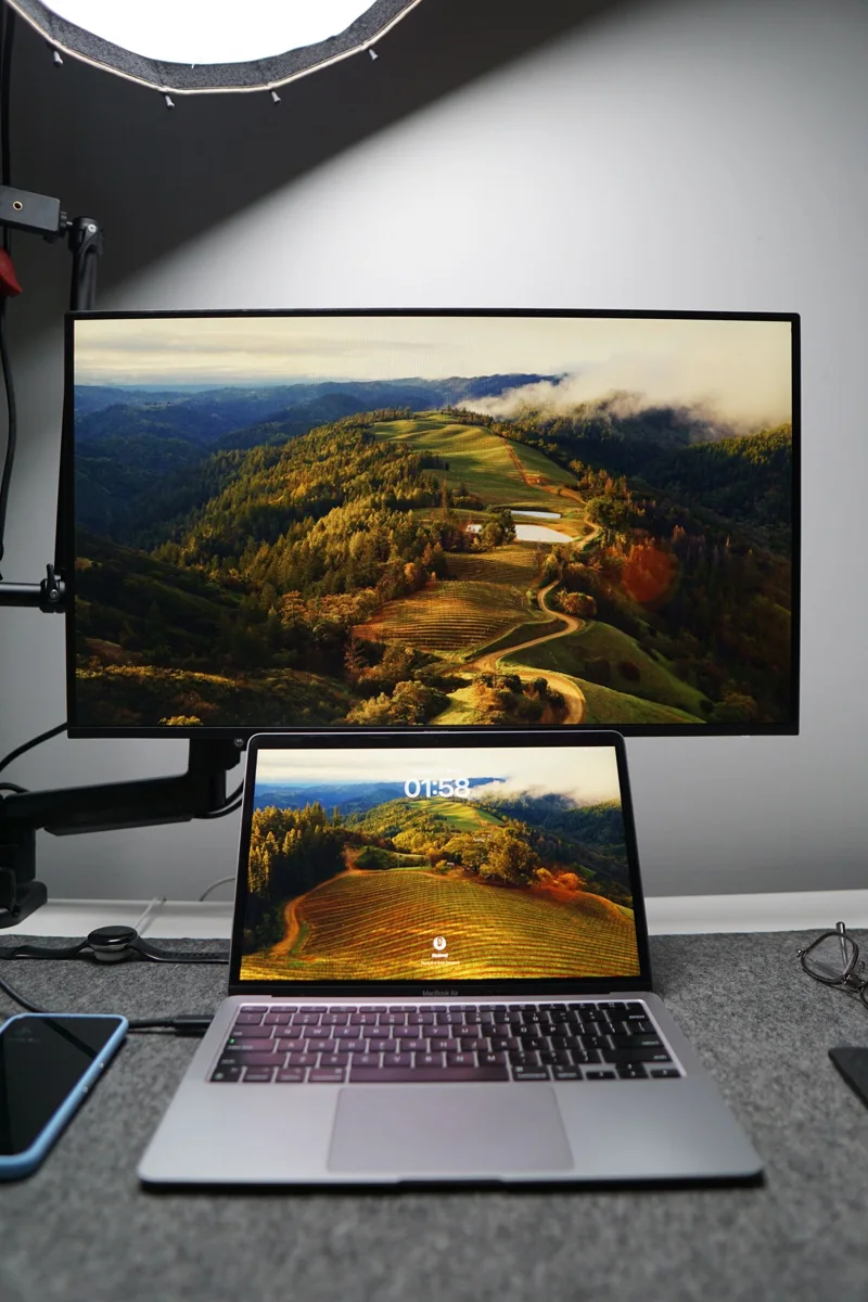 A desk with a laptop and an external monitor