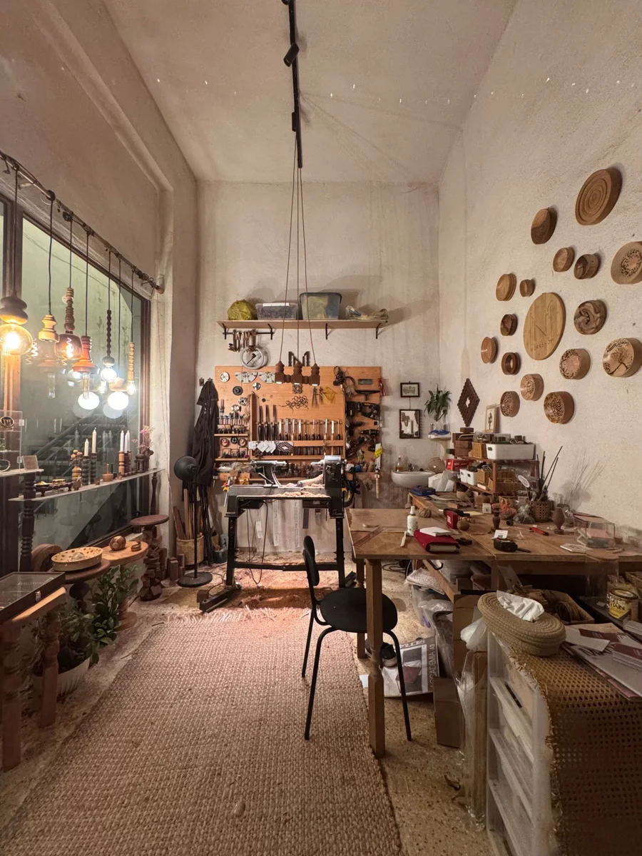 A craft workshop containing a workbench and tools