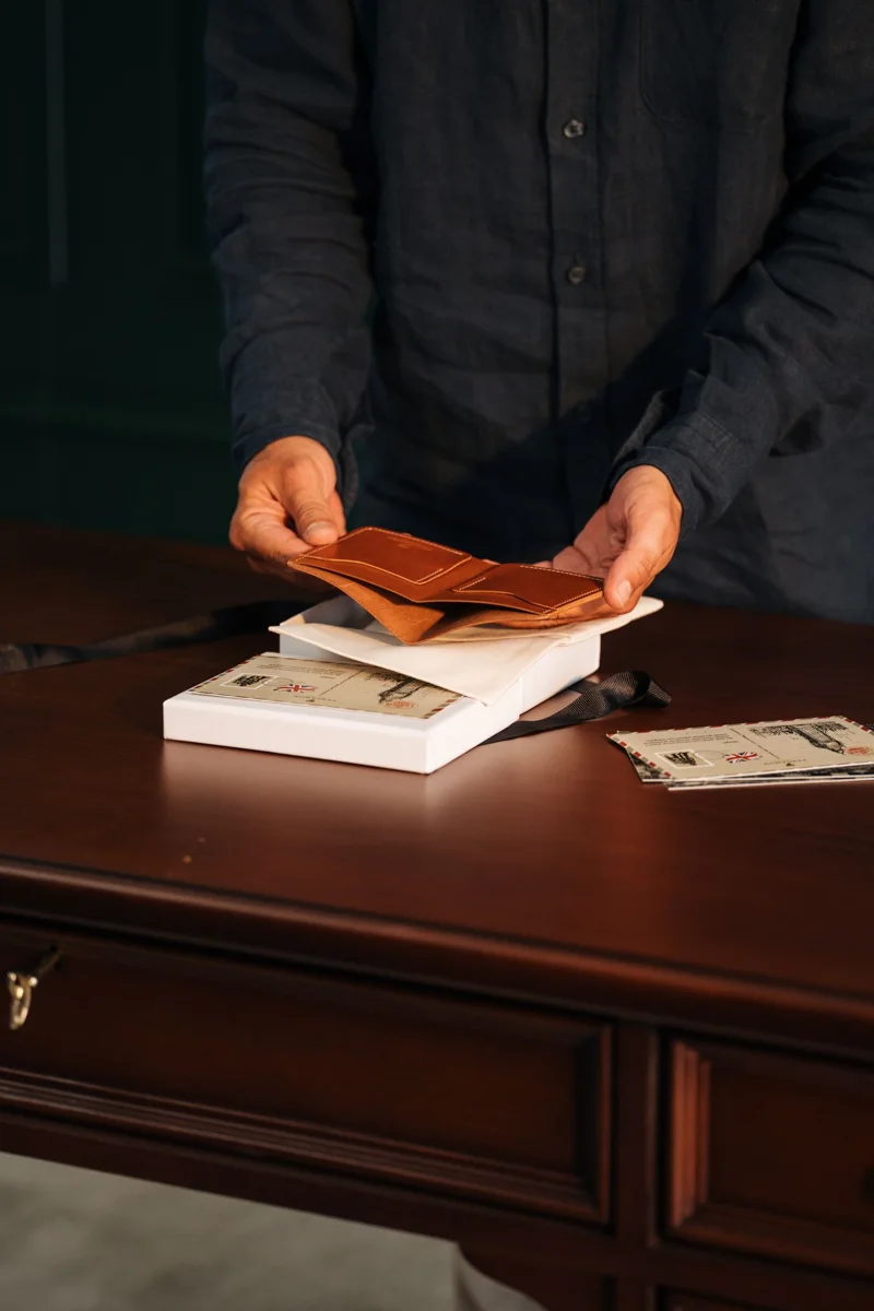 Hands arranging envelopes and letters